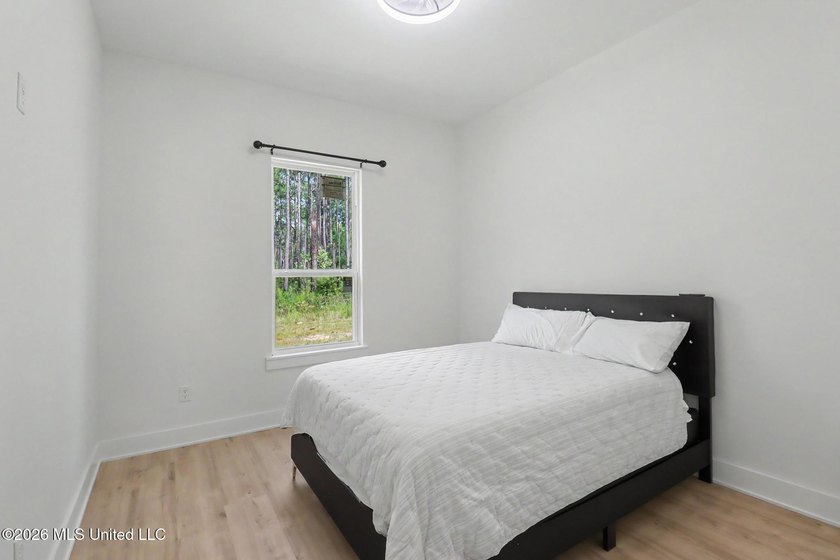 Welcome to this stunning custom-built 2025 home, where modern - photo 27