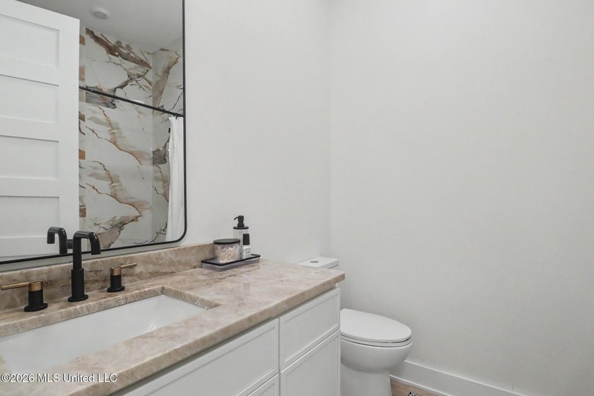 Welcome to this stunning custom-built 2025 home, where modern - photo 30