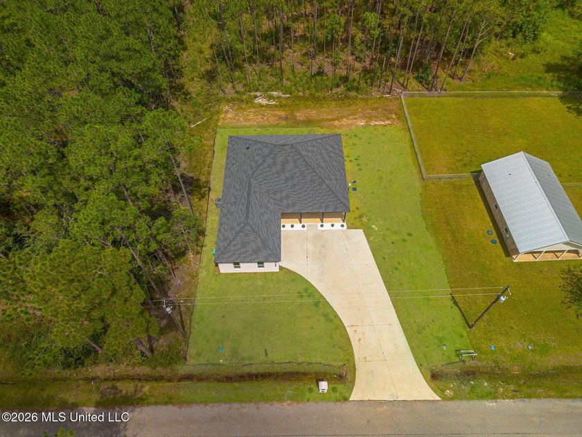 Welcome to this stunning custom-built 2025 home, where modern - photo 32
