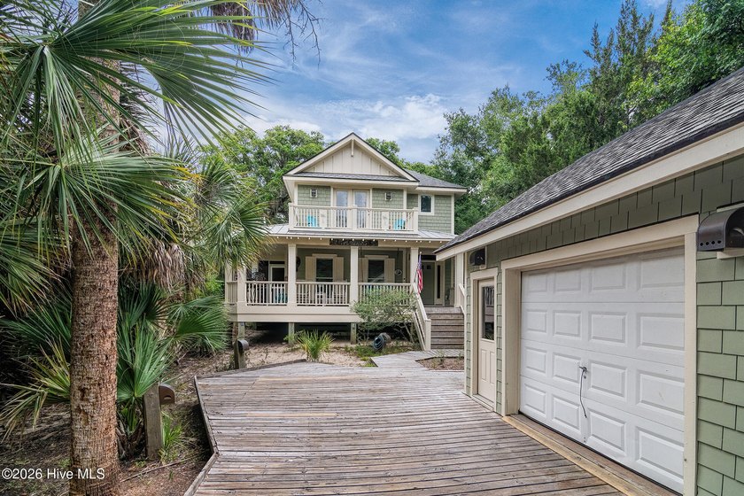 Discover this charming, well-kept secret nestled right in the - photo 2