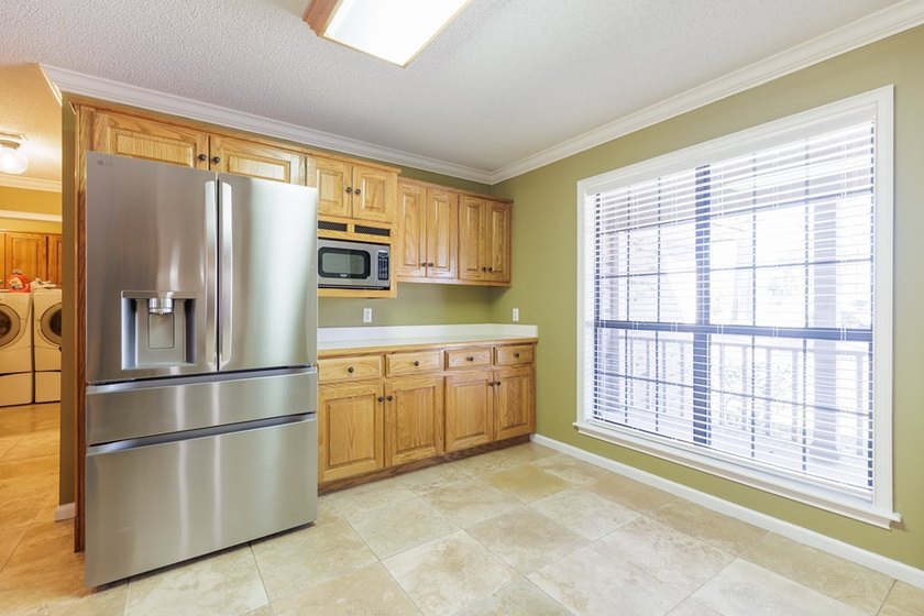 Lake Park living at its finest! This custom-built home truly - photo 29