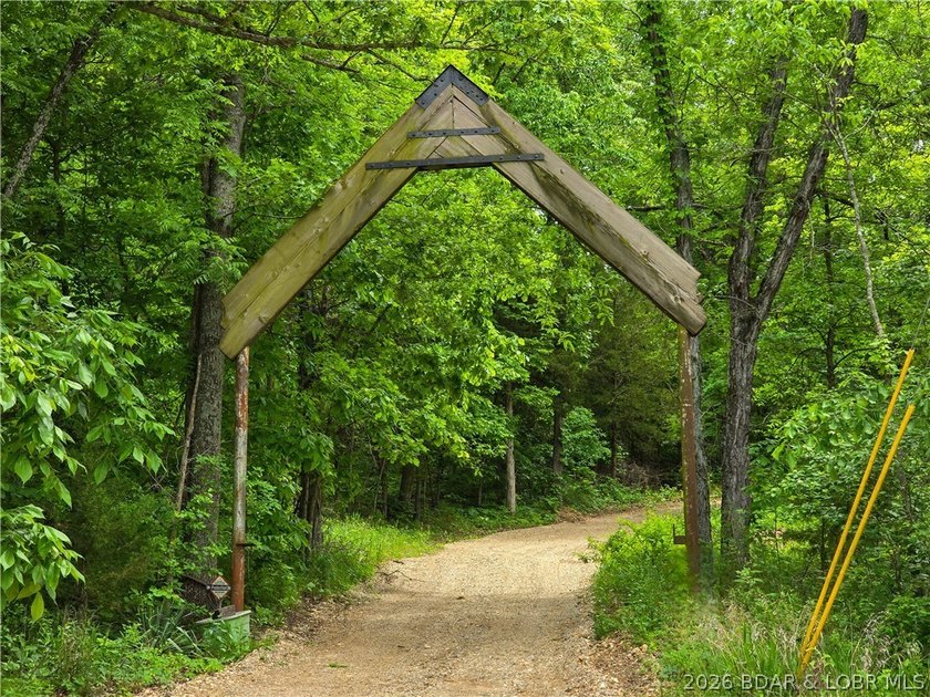 Travel beneath the wooden archway and feel the pace of life slow - photo 47