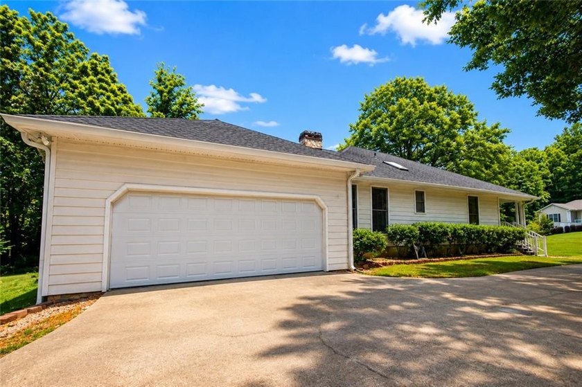 Welcome to this charming single-level home nestled in the - photo 33