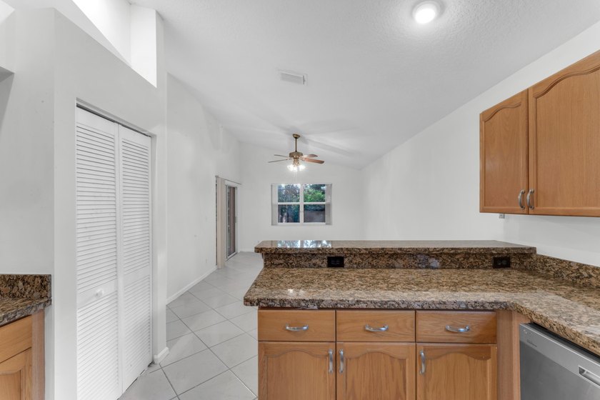 Move right into 3/2/2 in gated River Bridge. Newly painted, Roof - photo 12