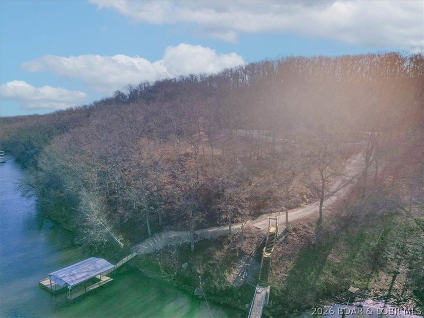 Prime 1.3-Acre Lakefront Canvas: Build Your Dream at Eagle Bay! - photo 18