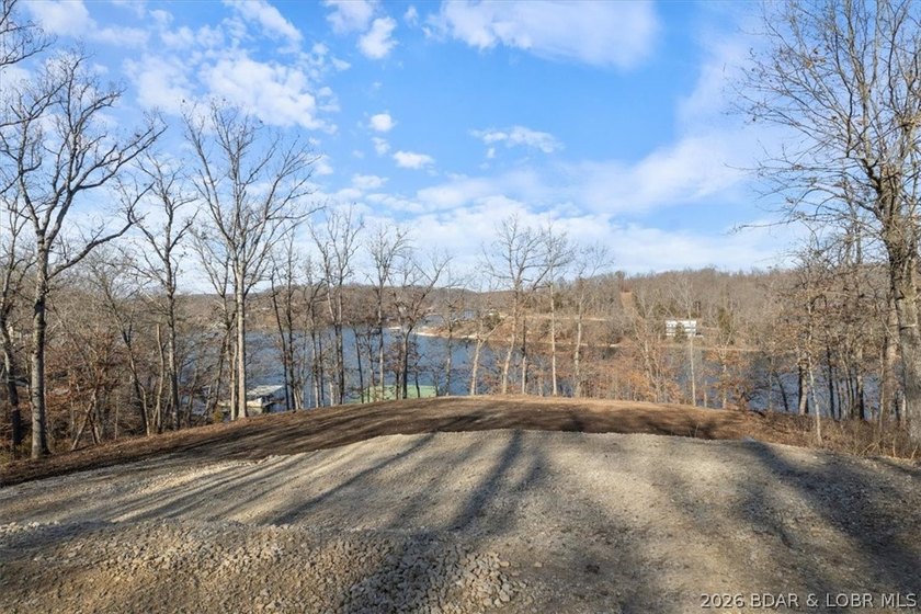 Prime 1.3-Acre Lakefront Canvas: Build Your Dream at Eagle Bay! - photo 20
