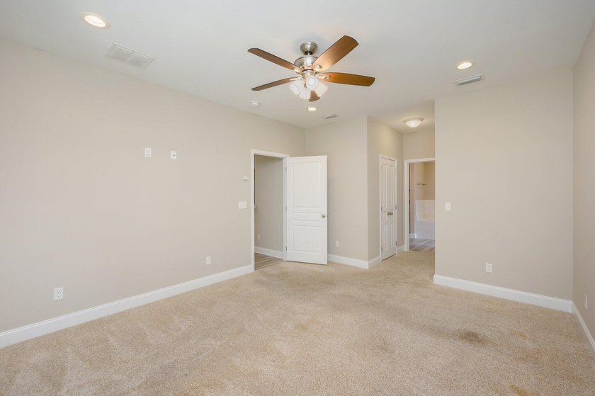 As you step inside, you are greeted with an open floor plan that - photo 14