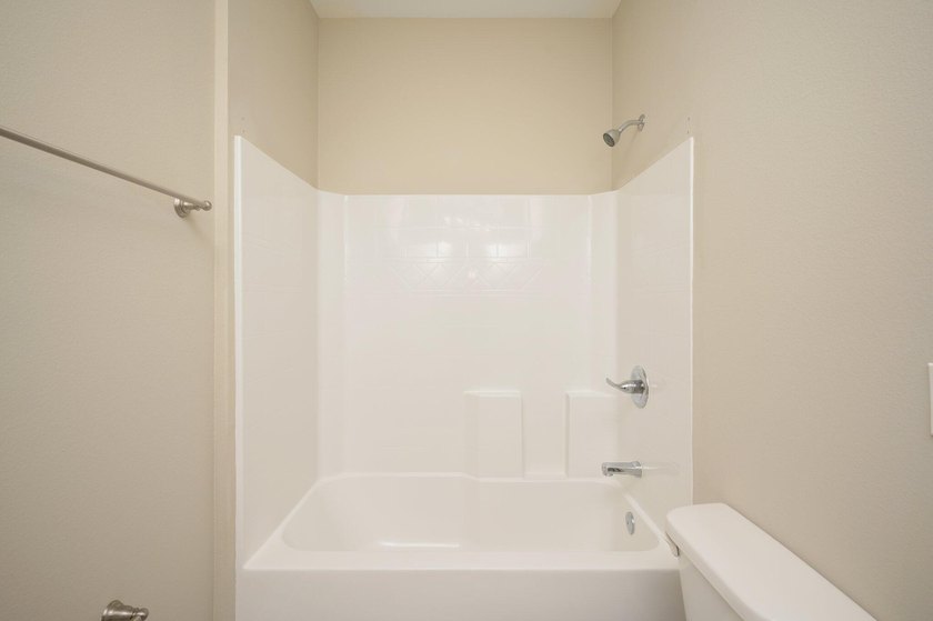 As you step inside, you are greeted with an open floor plan that - photo 30