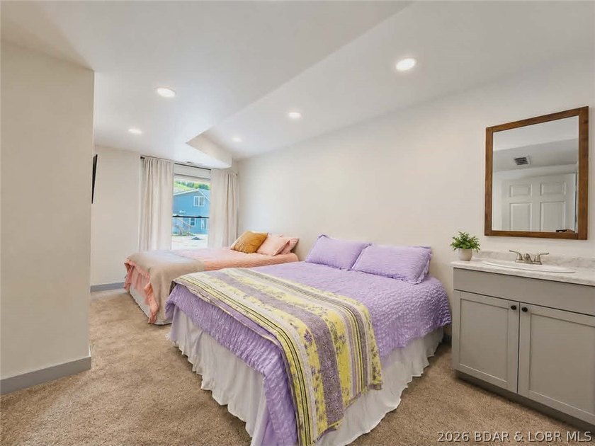 Step inside to vaulted ceilings and a stunning primary suite - photo 11