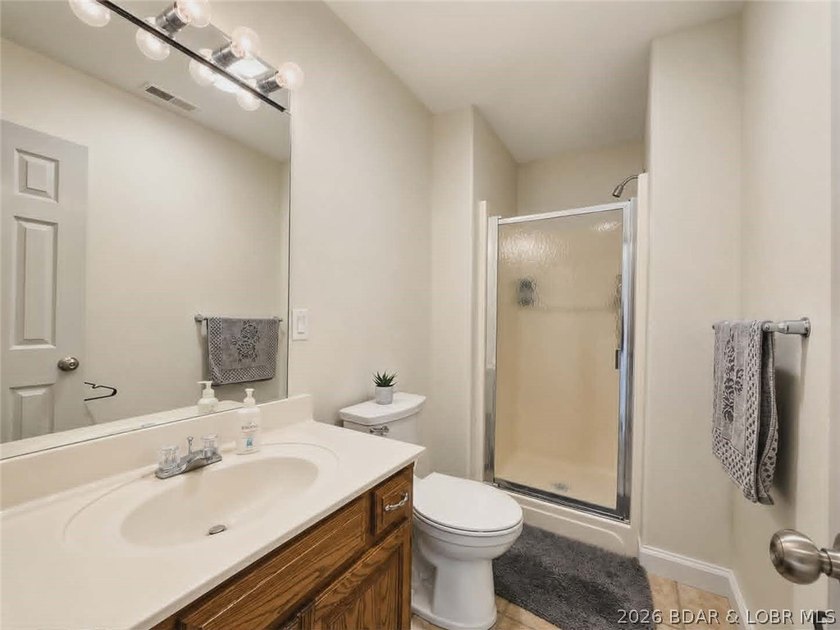 Step inside to vaulted ceilings and a stunning primary suite - photo 12