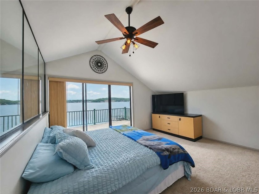 Step inside to vaulted ceilings and a stunning primary suite - photo 15