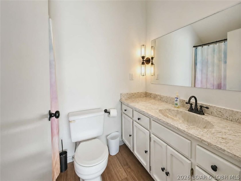 Step inside to vaulted ceilings and a stunning primary suite - photo 17