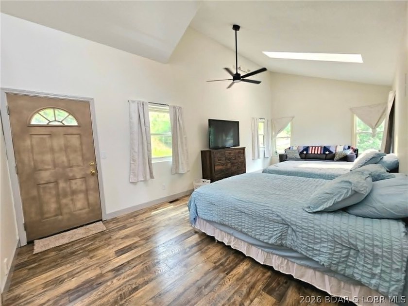 Step inside to vaulted ceilings and a stunning primary suite - photo 18