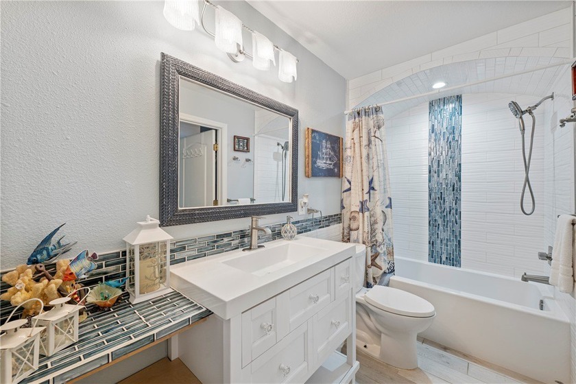 BEACHFRONT BEAUTY! Fabulously updated, this spacious 3-bedroom - photo 6