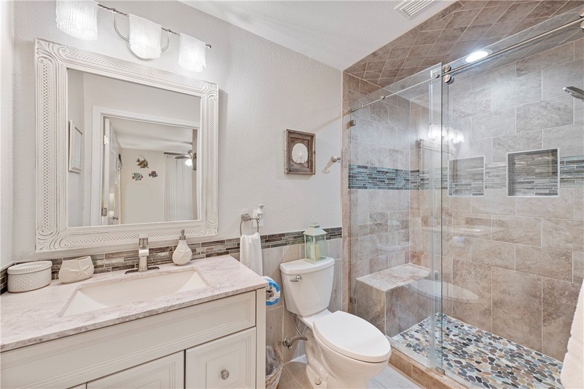 BEACHFRONT BEAUTY! Fabulously updated, this spacious 3-bedroom - photo 10