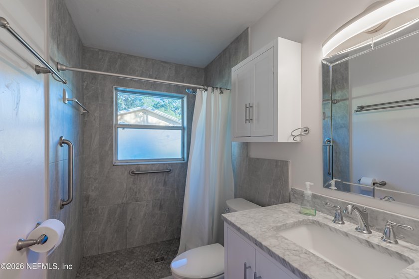 Wake up to peaceful lake views in this beautifully updated - photo 29