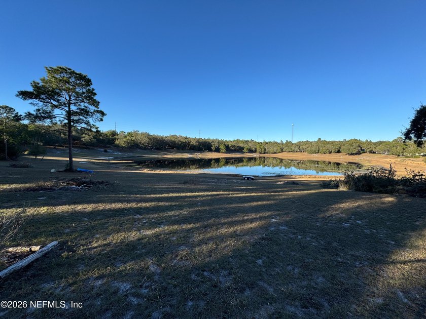 Wake up to peaceful lake views in this beautifully updated - photo 36