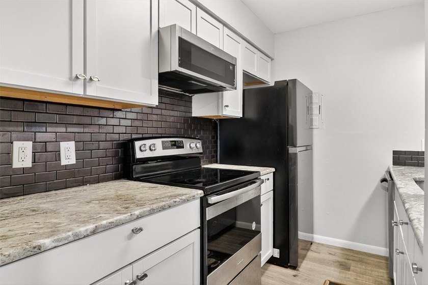 Pretty end unit offering extra privacy. Overlooks the old - photo 8