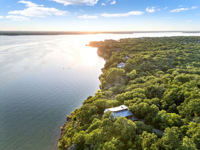 Experience a new level of lakeside living in the exclusive - photo 3