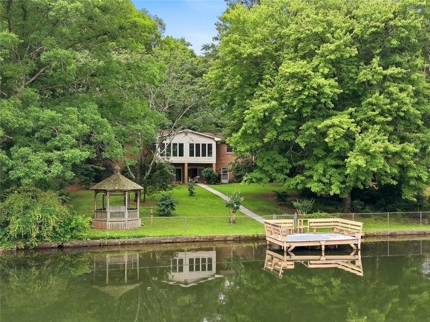 So much to love!! Lakeside retreat located ON THE WATER in the - photo 3