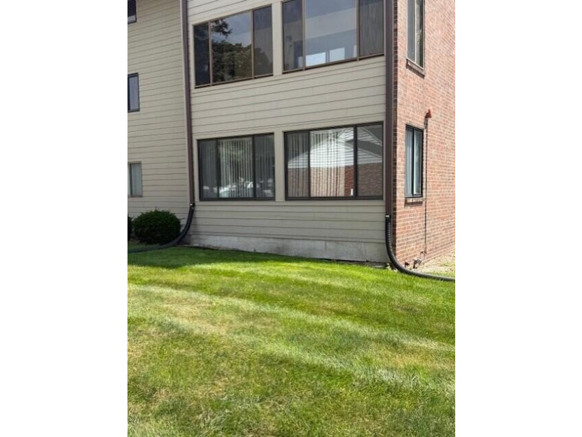 Main floor condo with enclosed patio on the north side of the - photo 2