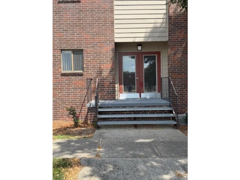 Main floor condo with enclosed patio on the north side of the - photo 3