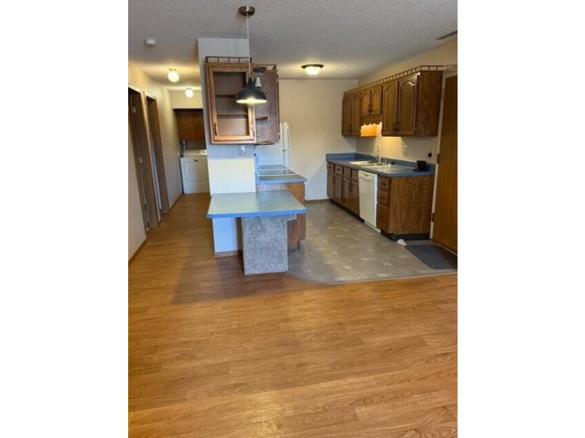 Main floor condo with enclosed patio on the north side of the - photo 5
