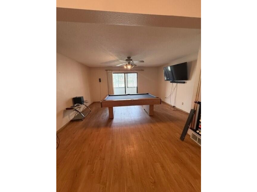 Main floor condo with enclosed patio on the north side of the - photo 10