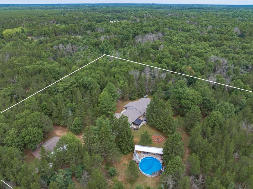 Tucked away on 6 secluded wooded acres, this 4BR, 2.5BA ranch - photo 21