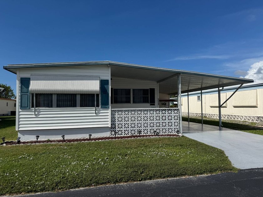 This 1971 home is offered turnkey and includes the golf cart! - photo 2