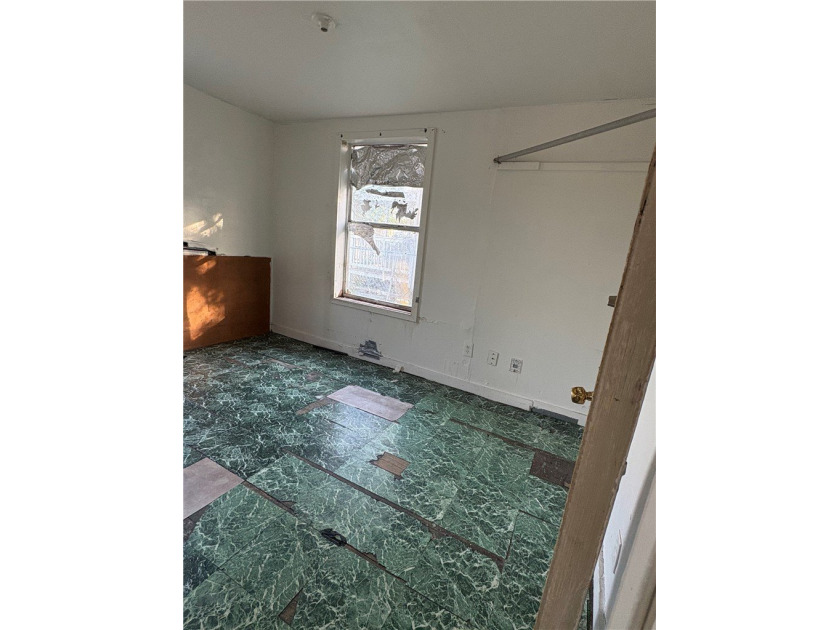 This 3-bedroom, 1-bath home sits on a large lot and offers - photo 4