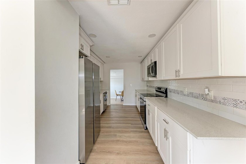 Short Sale. Welcome to this beautifully updated 4-bedroom - photo 6