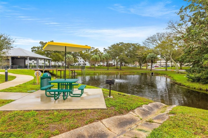 Wake up to peaceful views of a sparkling fountain pond from this - photo 25