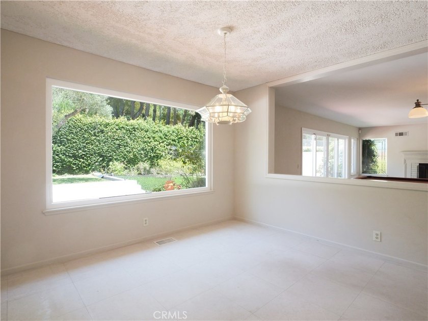 Situated on a quiet street overlooking a lush greenbelt in the - photo 15