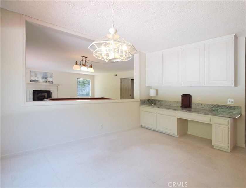 Situated on a quiet street overlooking a lush greenbelt in the - photo 16