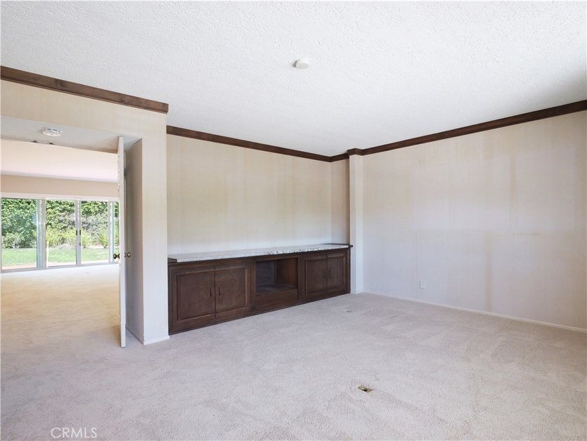 Situated on a quiet street overlooking a lush greenbelt in the - photo 30
