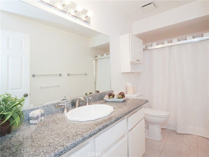 Situated on a quiet street overlooking a lush greenbelt in the - photo 33