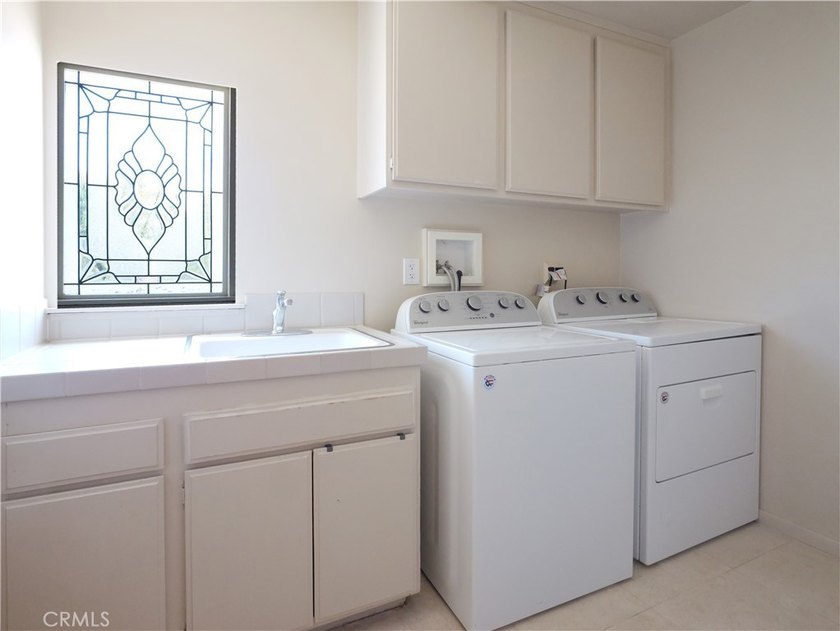 Situated on a quiet street overlooking a lush greenbelt in the - photo 34