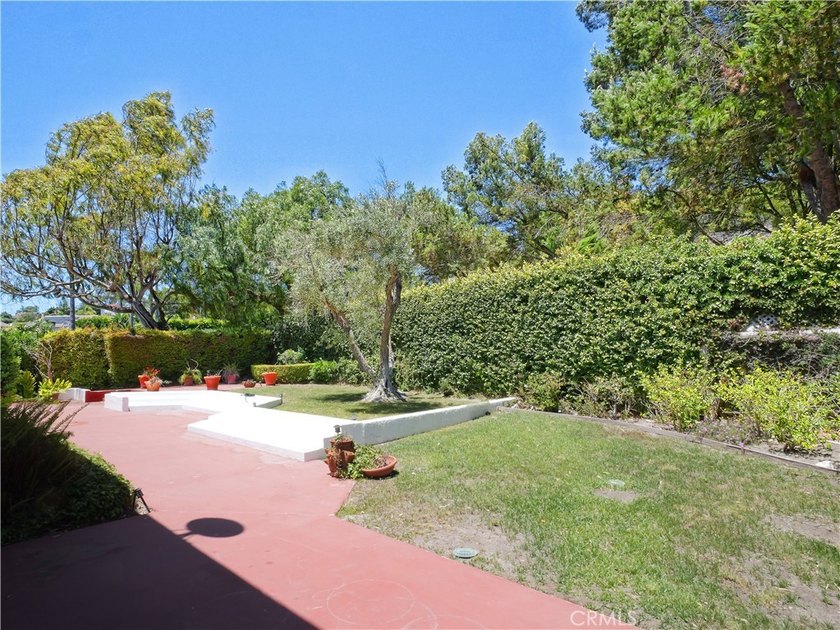 Situated on a quiet street overlooking a lush greenbelt in the - photo 38