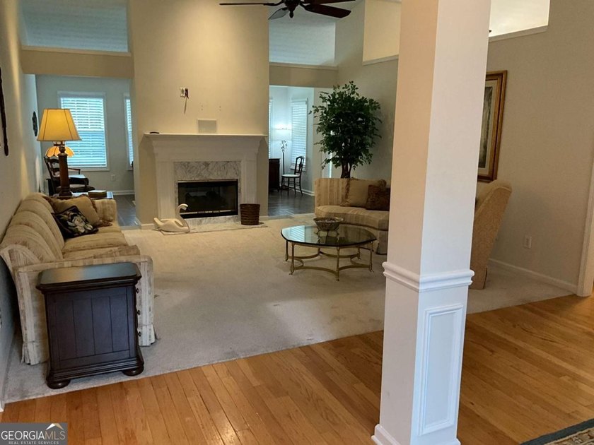 Welcoming large ranch home with 3 car garage in well established - photo 4