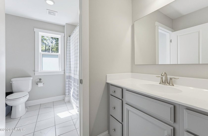 Beautifully set on a private, wooded lot in the sought-after - photo 31