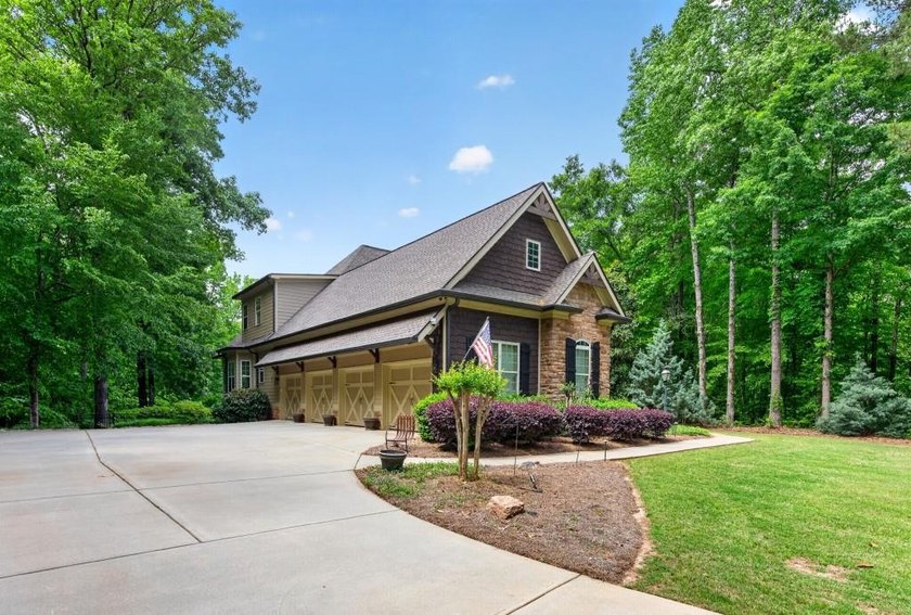 Drive up to your 4-bay garage and step into your own private - photo 7