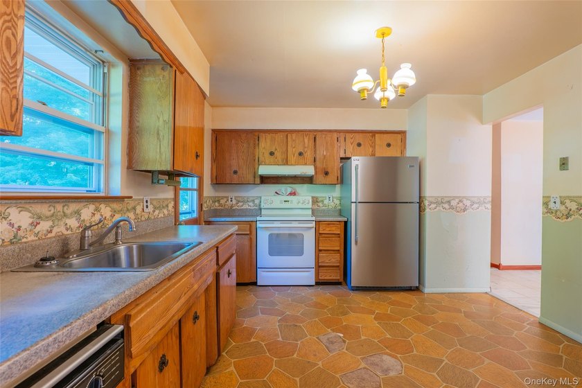 Welcome to 18 Sheryl Lane, a spacious raised ranch nestled on a - photo 12