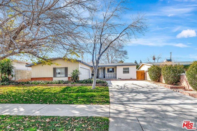 This charming single-story home blends mid-century character - photo 2