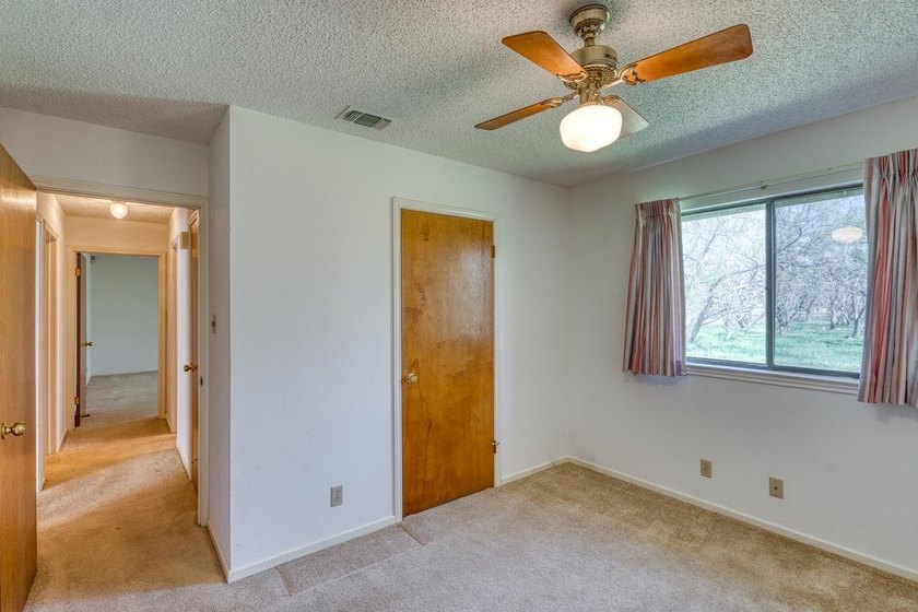 Opportunity awaits in this quaint brick home with a tile roof - photo 11