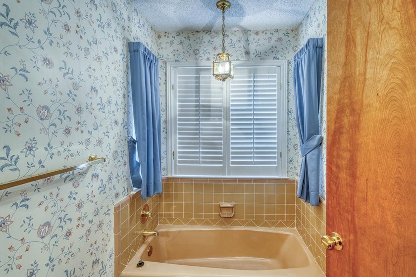 Opportunity awaits in this quaint brick home with a tile roof - photo 17
