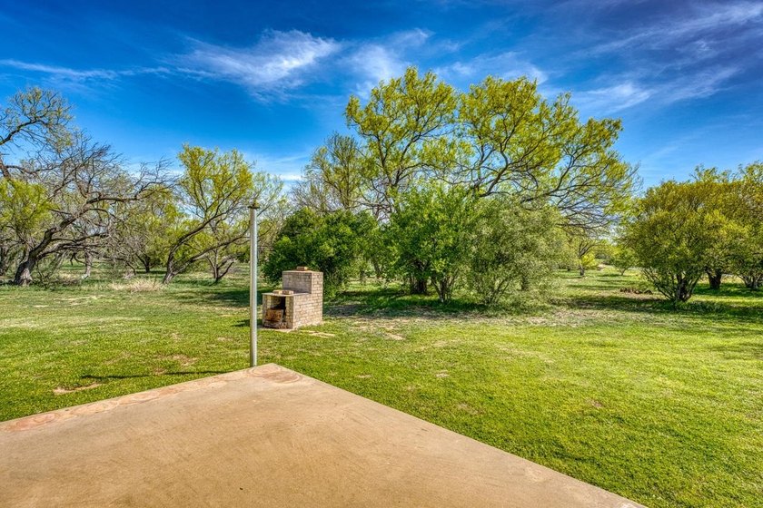 Opportunity awaits in this quaint brick home with a tile roof - photo 25