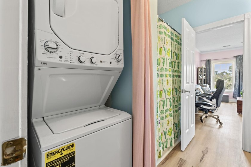This stunning second-floor 1-bedroom, 1.5-bath condo offers - photo 20