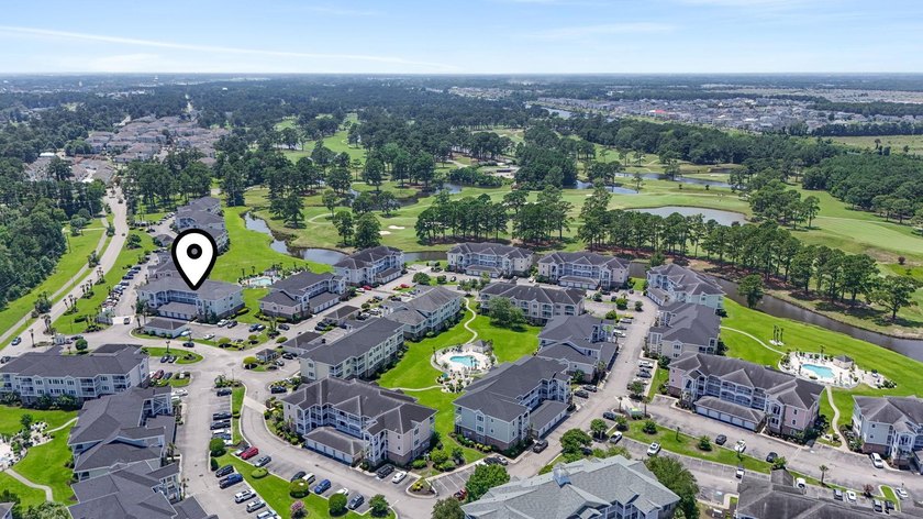 This stunning second-floor 1-bedroom, 1.5-bath condo offers - photo 25