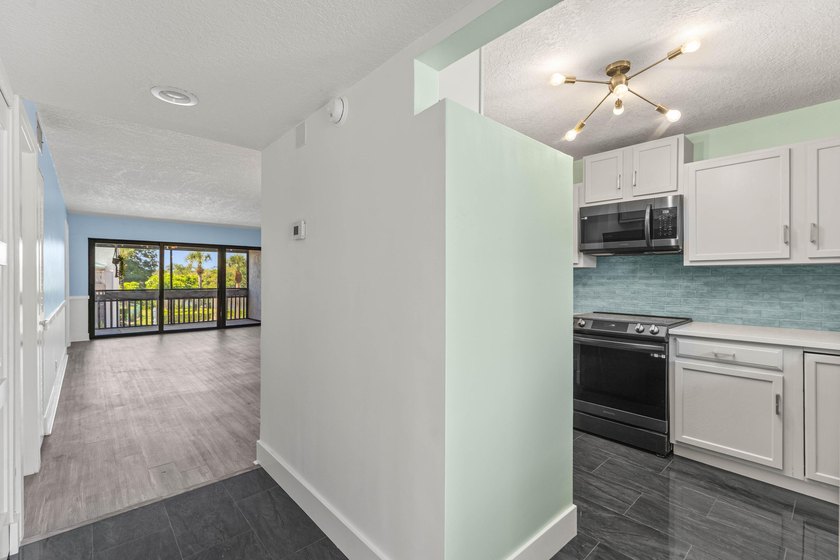 Newly remodeled 2/2 waterfront North Palm condo available on the - photo 13